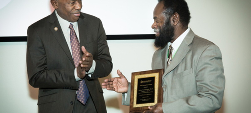 Dr. Sam Adunyah receiving award